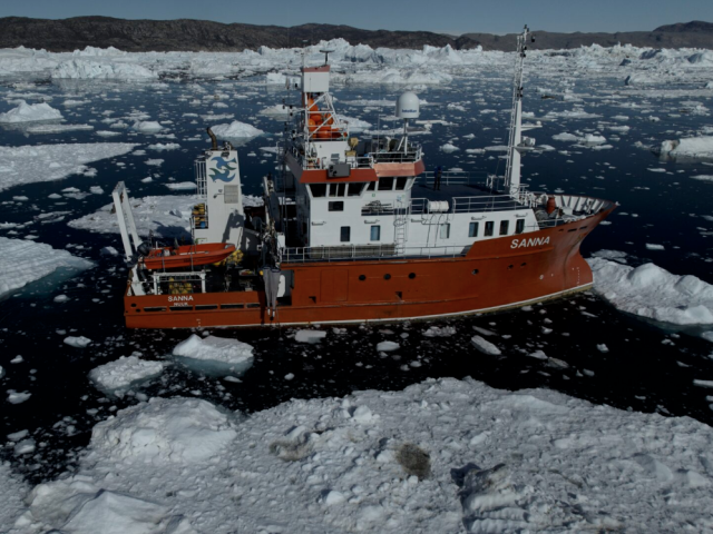 A research vessel navigates through icy waters during a recent expedition in West Greenland by new faculty member Fiamma Straneo