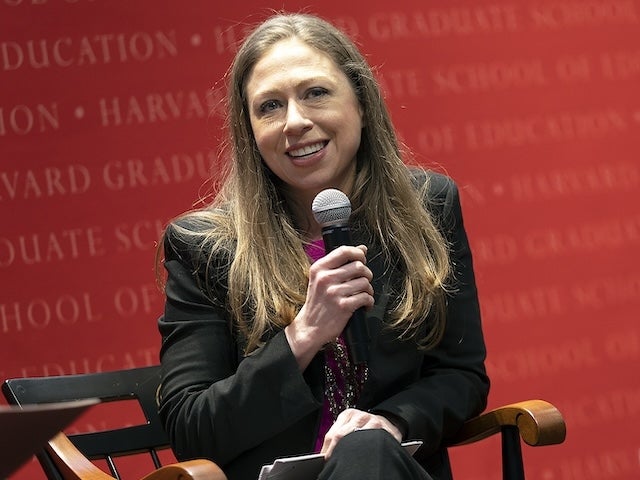 Chelsea Clinton holding a microphone