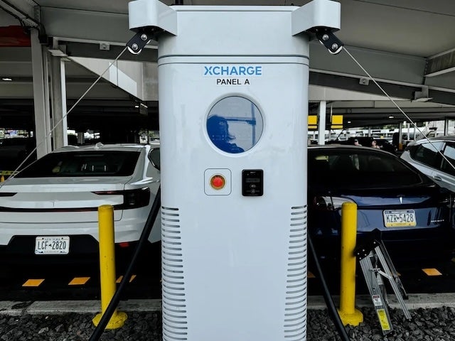An XCharge charger plugged into to EVs