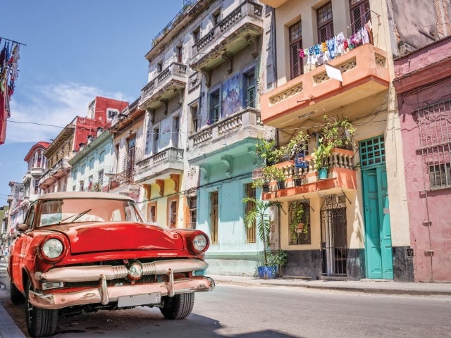 Classic red car in streets of Havana