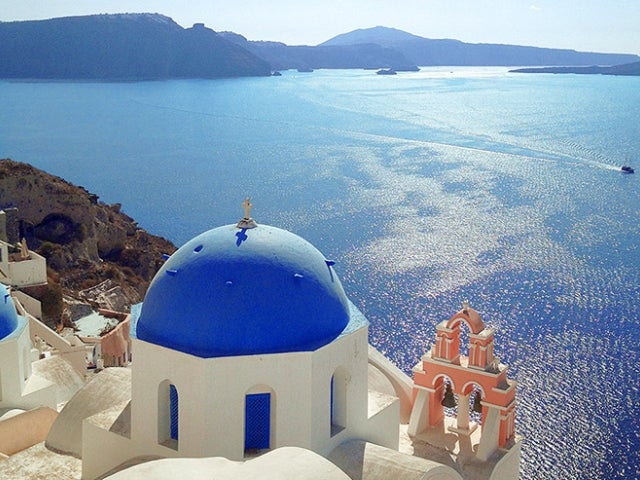 blue roofed building in Santorini