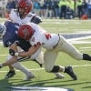 harvard football players tackle yale football player