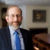 President Garber smiling in his office in Mass Hall