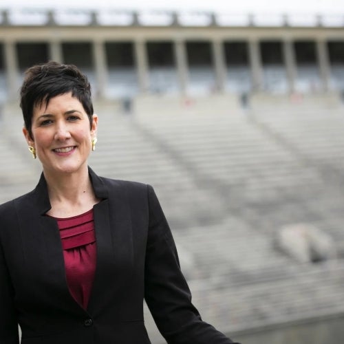 Erin McDermott with Harvard Stadium in the background