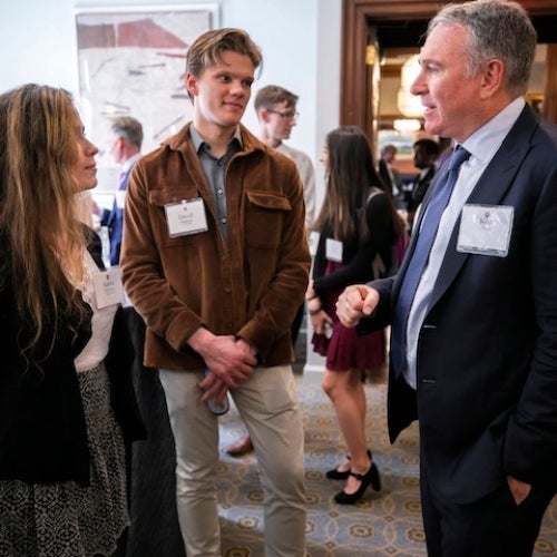 Kenneth C. Griffin speaks with students Naomi Bashkansky and David Paquette