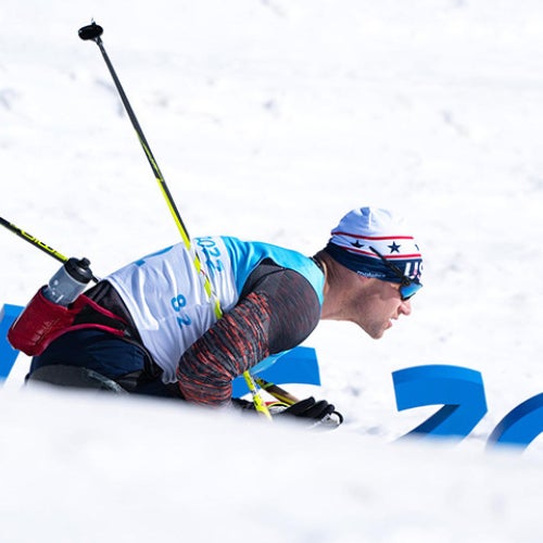 Dan Cnossen skiing with snow in the foreground and background