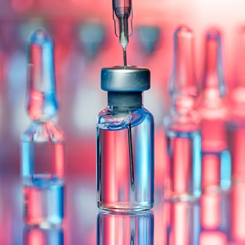 Stylized photograph of unlabeled bottles of vaccine