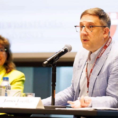 James Loeffler speaks into a microphone