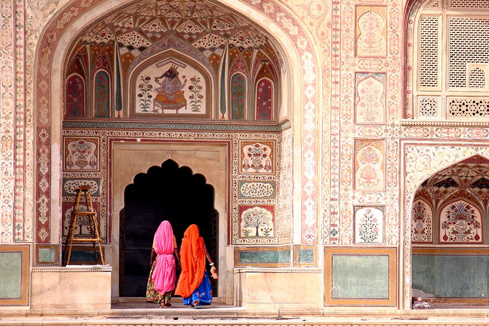 women going into building