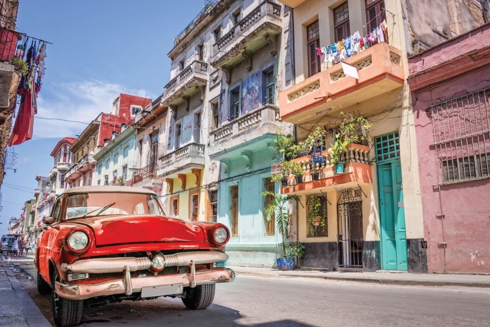 Classic red car in streets of Havana