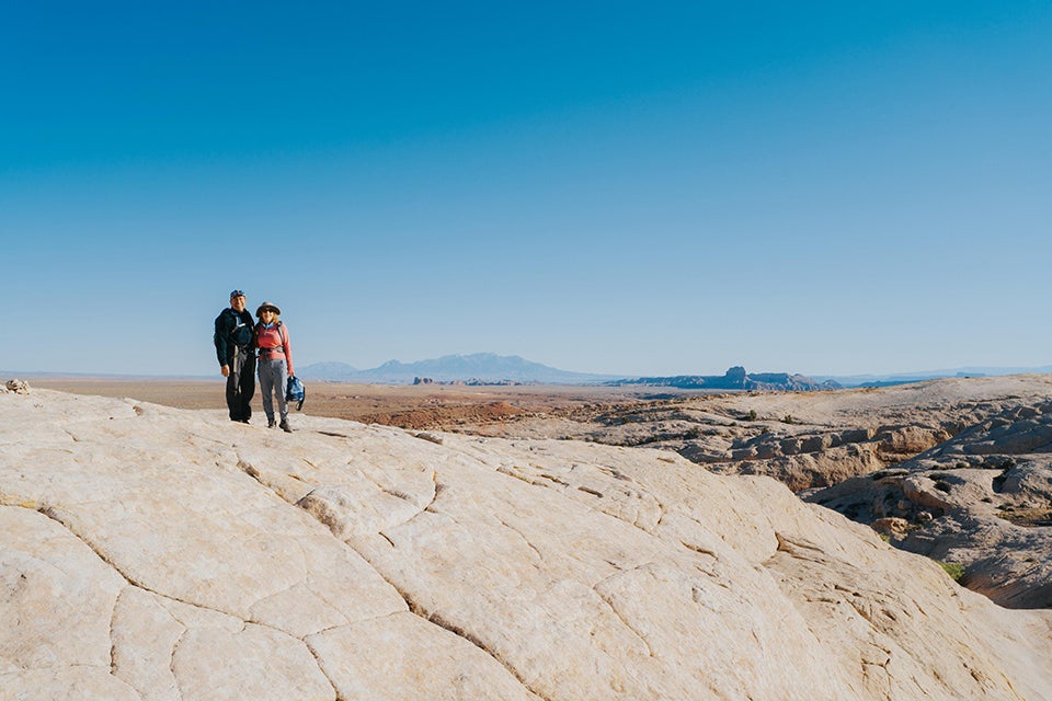 people standing on rocks