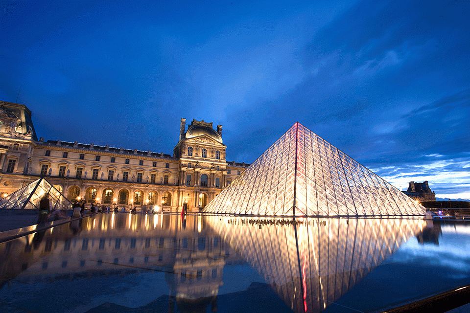 exterior of the Louvre at night