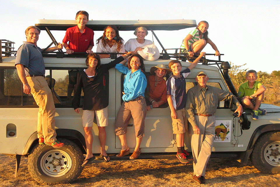family on safari vehicle