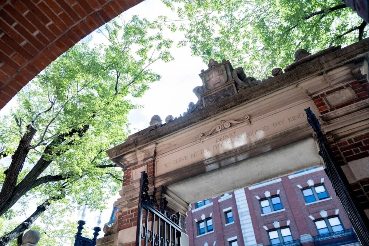 Dexter Gate in Harvard Yard is inscribed with the words: "Depart to serve better thy country and thy kind"